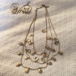 Necklace layered with matching earrings